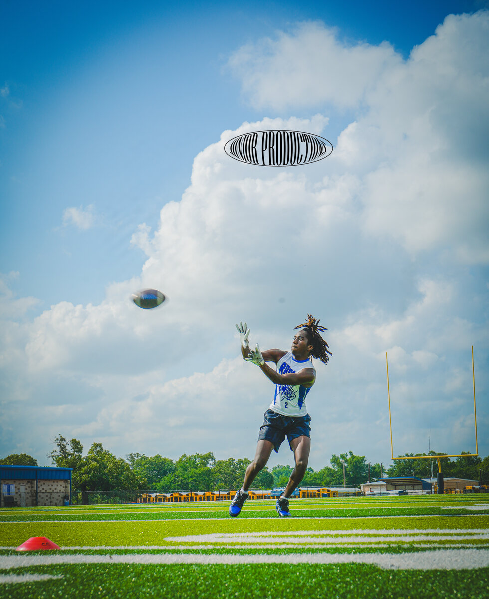 Football receiver catching a pass